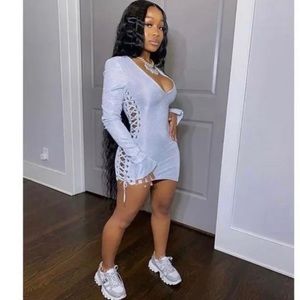 Silver dress with slits on the side either casual or party oriented